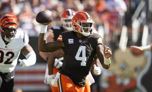 Cleveland Browns quarterback Deshaun Watson (4) looks to pass in the first half of an NFL football game against the Cincinnati Bengals, Sunday, Oct. 20, 2024, in Cleveland. (AP Photo/Sue Ogrocki)