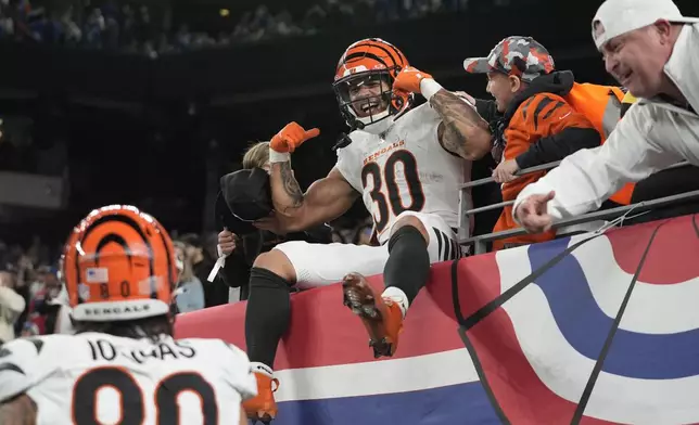 Cincinnati Bengals running back Chase Brown (30) celebrates with fans after scoring a touchdown in the second half of an NFL football game against the New York Giants, Sunday, Oct. 13, 2024, in East Rutherford, N.J. (AP Photo/Frank Franklin II)