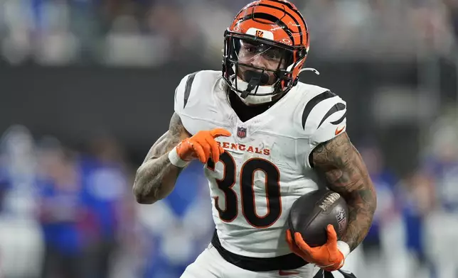 Cincinnati Bengals running back Chase Brown (30) runs for a touchdown during the second half of an NFL football game against the New York Giants, Sunday, Oct. 13, 2024, in East Rutherford, N.J. (AP Photo/Frank Franklin II)