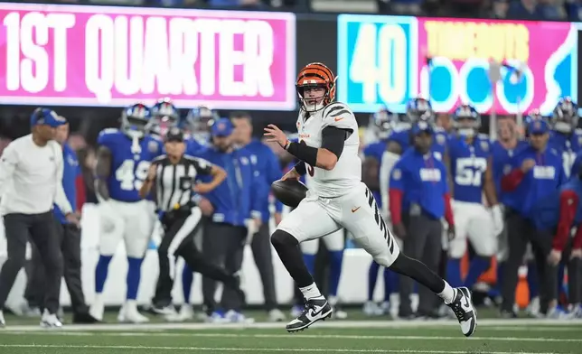 Cincinnati Bengals quarterback Joe Burrow runs for a touchdown during the first half of an NFL football game against the New York Giants, Sunday, Oct. 13, 2024, in East Rutherford, N.J. (AP Photo/Frank Franklin II)