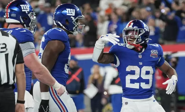 New York Giants running back Tyrone Tracy Jr. (29) celebrates scoring a touchdown during the second half of an NFL football game against the Cincinnati Bengals, Sunday, Oct. 13, 2024, in East Rutherford, N.J.(AP Photo/Seth Wenig)