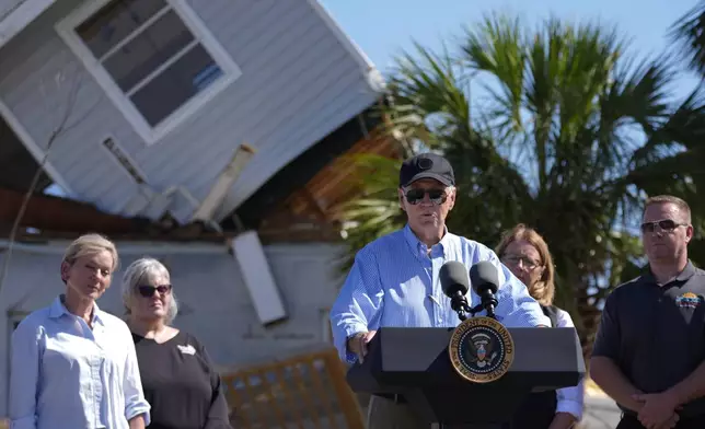 President Joe Biden speaks following a briefing by federal, state, and local officials in St. Pete Beach, Fla., during a tour of areas affected by Hurricane Milton, Sunday, Oct. 13, 2024. (AP Photo/Manuel Balce Ceneta)