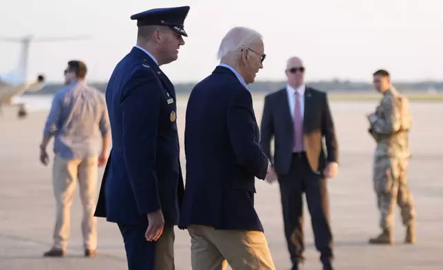 President Joe Biden walks to board Air Force One he departs Joint Base Andrews, Md., on his way to Tampa, Fla, to visit the Hurricane Milton affected areas, Sunday, Oct. 13, 2024. (AP Photo/Manuel Balce Ceneta)