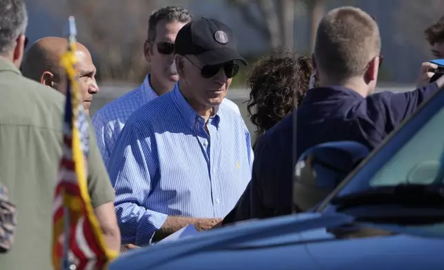 President Joe Biden arrives to be briefed by federal, state, and local officials in St. Pete Beach, Fla., following an aerial tour of areas affected by Hurricane Milton, Sunday, Oct. 13, 2024. (AP Photo/Manuel Balce Ceneta)