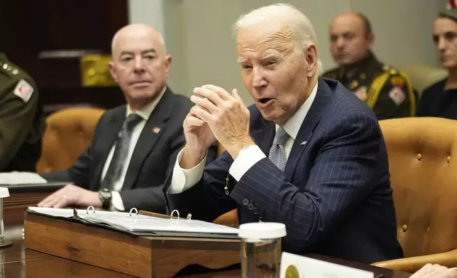 President Joe Biden speaks about the federal government's response to Hurricanes Milton and Helene as Homeland Security Secretary Alejandro Mayorkas listens, in the Roosevelt Room of the White House, Friday, Oct. 11, 2024, in Washington. (AP Photo/Manuel Balce Ceneta)