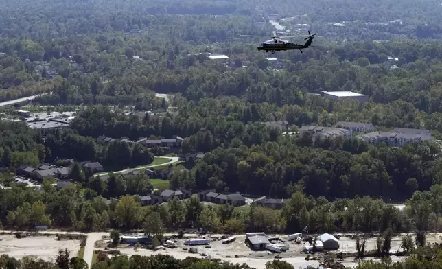 Marine One, with President Joe Biden on board, flies around areas impacted by Hurricane Helene over Asheville, N.C., Wednesday, Oct. 2, 2024. (AP Photo/Susan Walsh) (AP Photo/Susan Walsh)