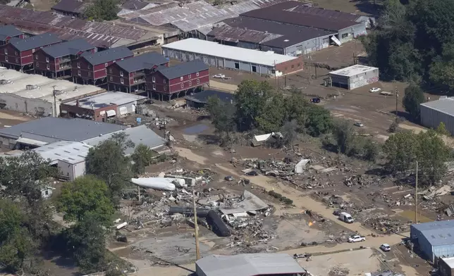 A view of damage in Asheville, N.C., is seen during an aerial tour with President Joe Biden who looked at areas impacted by Hurricane Helene near Asheville, N.C., Wednesday, Oct. 2, 2024. (AP Photo/Susan Walsh)