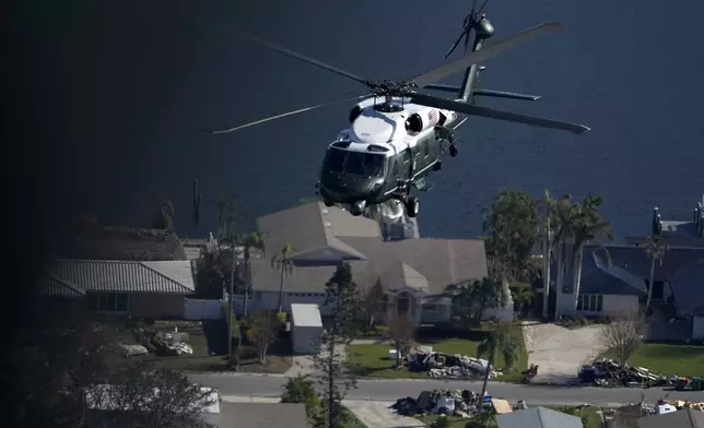 With President Joe Biden aboard, Marine One surveys areas affected by Hurricane Milton in Florida, from Tampa to St. Petersburg, Sunday, Oct. 13, 2024. (AP Photo/Manuel Balce Ceneta)