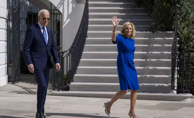 President Joe Biden, left, and first lady Jill Biden walk to Marine One on the South Lawn of the White House in Washington, Saturday, Oct. 5, 2024. (AP Photo/Ben Curtis)