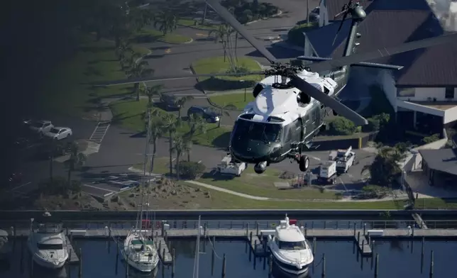 With President Joe Biden aboard, Marine One surveys areas affected by Hurricane Milton in Florida, from Tampa to St. Petersburg, Sunday, Oct. 13, 2024. (AP Photo/Manuel Balce Ceneta)