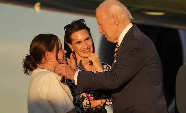 President Joe Biden greets people as he arrives at Phoenix Sky Harbor International Airport, Thursday, Oct. 24, 2024 in Phoenix. (AP Photo/Manuel Balce Ceneta)