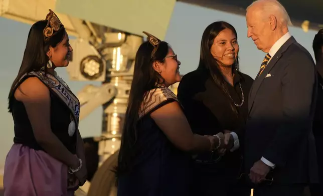 President Joe Biden greets people as he arrives at Phoenix Sky Harbor International Airport, Thursday, Oct. 24, 2024 in Phoenix. (AP Photo/Manuel Balce Ceneta)