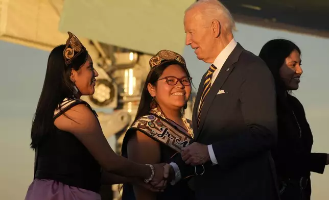 President Joe Biden greets people as he arrives at Phoenix Sky Harbor International Airport, Thursday, Oct. 24, 2024 in Phoenix. (AP Photo/Manuel Balce Ceneta)