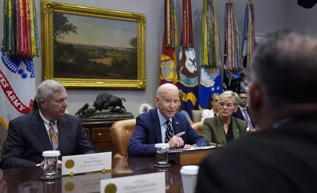 President Joe Biden delivers remarks on the federal government's response to Hurricane Helene and preparations for Hurricane Milton in the Roosevelt Room of the White House, Tuesday, Oct. 8, 2024, in Washington, as Secretary of Agriculture Tom Vilsack, left, and Secretary of Energy Jennifer Granholm, right, look on. (AP Photo/Evan Vucci)