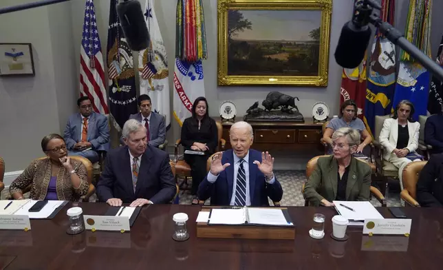 President Joe Biden delivers remarks on the federal government's response to Hurricane Helene and preparations for Hurricane Milton in the Roosevelt Room of the White House, Tuesday, Oct. 8, 2024, in Washington, as from seated left, Acting Secretary of Housing and Urban Development Adrianne Todman, Secretary of Agriculture Tom Vilsack, Biden, and Secretary of Energy Jennifer Granholm, right, look on. (AP Photo/Evan Vucci)