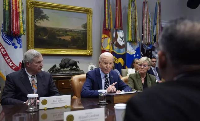 President Joe Biden delivers remarks on the federal government's response to Hurricane Helene and preparations for Hurricane Milton in the Roosevelt Room of the White House, Tuesday, Oct. 8, 2024, in Washington, as Secretary of Agriculture Tom Vilsack, left, and Secretary of Energy Jennifer Granholm, right, look on. (AP Photo/Evan Vucci)