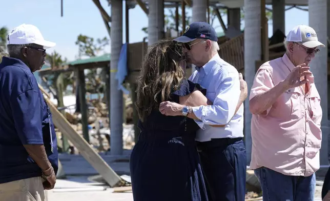 President Joe Biden greets people in Keaton Beach, Fla., Thursday, Oct. 3, 2024, during his tour of areas impacted by Hurricane Helene. (AP Photo/Susan Walsh)