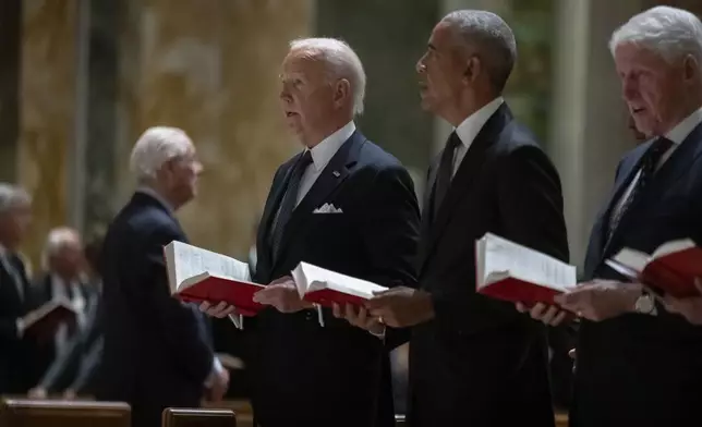 President Joe Biden, left, and former Presidents Barack Obama, center, and Bill Clinton, right, attend a memorial service for Ethel Kennedy, the wife of Sen. Robert F. Kennedy, who died, Oct. 10, 2024, at age 96, at the Cathedral of St. Matthew the Apostle in Washington, Wednesday, Oct. 16, 2024. (AP Photo/Ben Curtis)