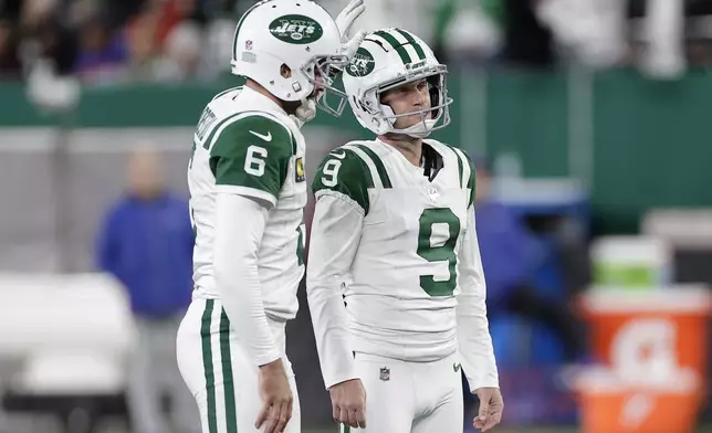 New York Jets place kicker Greg Zuerlein (9) reacts after missing a field goal attempt with Thomas Morstead during the second half of an NFL football game against the Buffalo Bills in East Rutherford, N.J., Monday, Oct. 14, 2024. (AP Photo/Adam Hunger)