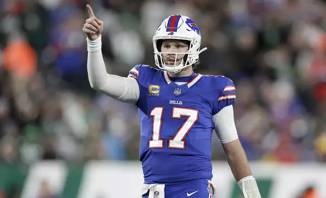 Buffalo Bills quarterback Josh Allen (17) gestures during the first half of an NFL football game against the New York Jets in East Rutherford, N.J., Monday, Oct. 14, 2024. (AP Photo/Adam Hunger)