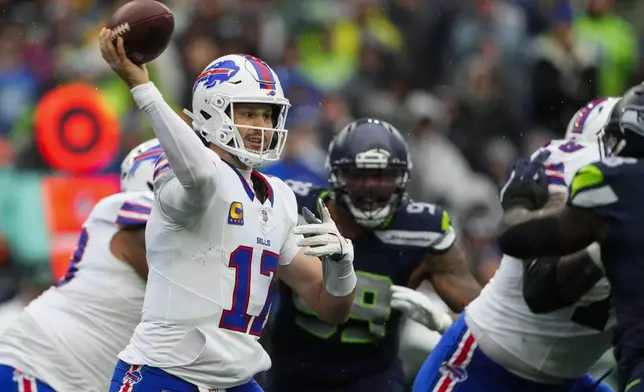 Buffalo Bills quarterback Josh Allen (17) throws during the first half of an NFL football game against the Seattle Seahawks, Sunday, Oct. 27, 2024, in Seattle. (AP Photo/Lindsey Wasson)