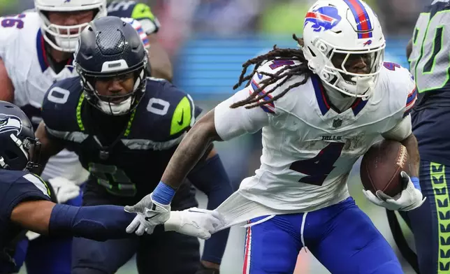 Buffalo Bills running back James Cook (4) rushes the ball during the second half of an NFL football game against the Seattle Seahawks, Sunday, Oct. 27, 2024, in Seattle. (AP Photo/Lindsey Wasson)