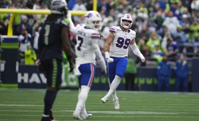 Buffalo Bills defensive end Casey Toohill (99) celebrates after an interception during the second half of an NFL football game against the Seattle Seahawks, Sunday, Oct. 27, 2024, in Seattle. (AP Photo/Lindsey Wasson)