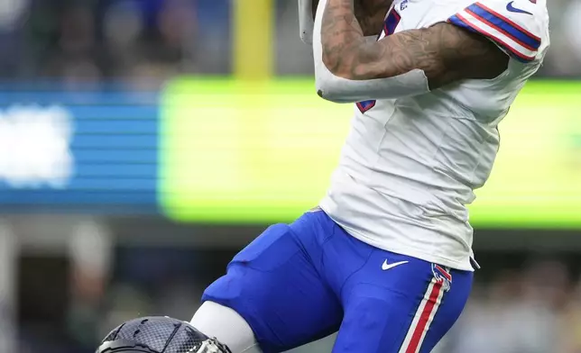 Buffalo Bills wide receiver Keon Coleman (0) makes a catch over Seattle Seahawks cornerback Josh Jobe (29) during the second half of an NFL football game, Sunday, Oct. 27, 2024, in Seattle. (AP Photo/Lindsey Wasson)