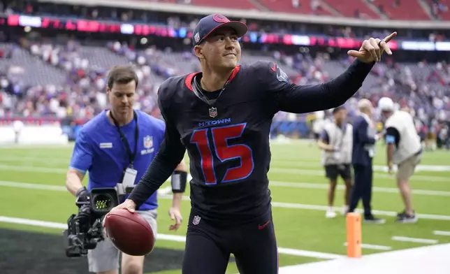 Houston Texans place kicker Ka'imi Fairbairn runs off the field after kicking a 59-yard field goal on the last play of an NFL football game against the Buffalo Bills, Sunday, Oct. 6, 2024, in Houston. The Texans won 23-20. (AP Photo/Eric Christian Smith)