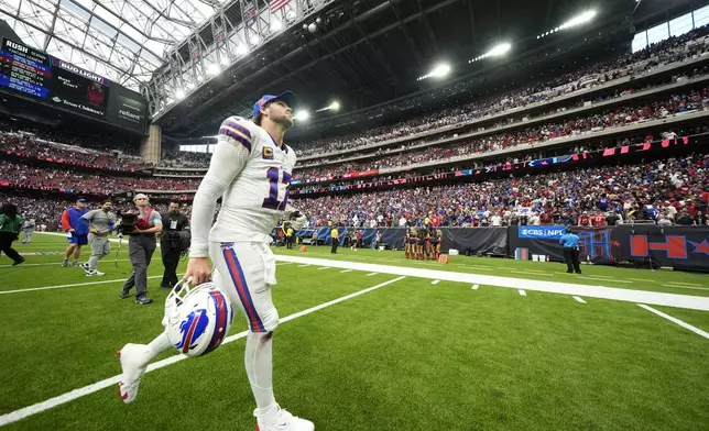 Buffalo Bills quarterback Josh Allen (17) walks off the field after an NFL football game against the Houston Texans, Sunday, Oct. 6, 2024, in Houston. The Texans won 23-20. (AP Photo/Eric Gay)