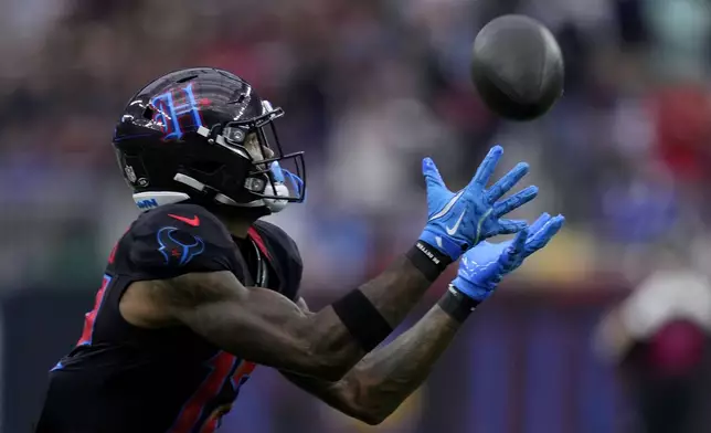 Houston Texans wide receiver Nico Collins catches a 67-yard touchdown pass during the first half of an NFL football game against the Buffalo Bills, Sunday, Oct. 6, 2024, in Houston. (AP Photo/Eric Christian Smith)