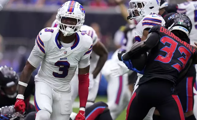 Buffalo Bills safety Damar Hamlin (3) celebrates after stopping Houston Texans running back Dare Ogunbowale (33) on a fourth down run during the first half of an NFL football game, Sunday, Oct. 6, 2024, in Houston. (AP Photo/Eric Christian Smith)