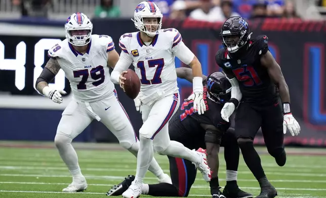 Buffalo Bills quarterback Josh Allen (17) runs from Houston Texans defensive end Will Anderson Jr. (51) during the second half of an NFL football game, Sunday, Oct. 6, 2024, in Houston. (AP Photo/Eric Christian Smith)