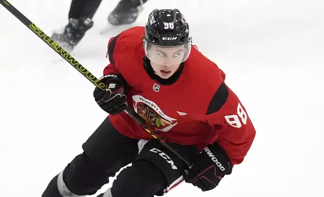Chicago Blackhawks' Connor Bedard participates in the team's NHL hockey training camp Thursday, Sept. 19, 2024, in Chicago. (AP Photo/Charles Rex Arbogast)