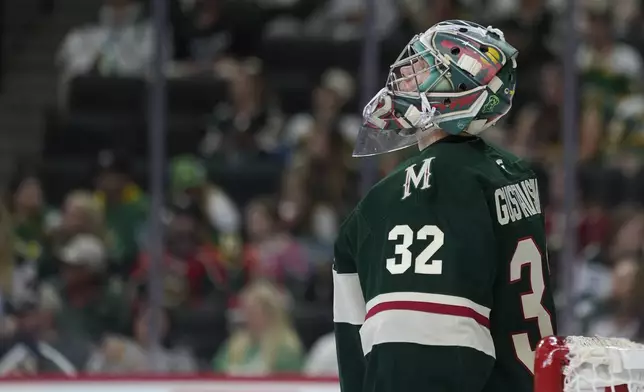 Minnesota Wild goaltender Filip Gustavsson (32) looks at the videoboard after a goal by Columbus Blue Jackets center Kent Johnson (91) during the second period of an NHL hockey game, Thursday, Oct. 10, 2024, in St. Paul, Minn. (AP Photo/Abbie Parr)