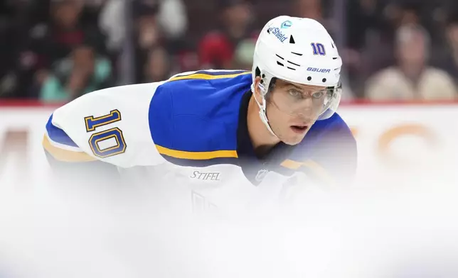 St. Louis Blues center Brayden Schenn (10) lines up during a face-off while taking on the Ottawa Senators in the second period of an NHL hockey game in Ottawa, Ontario, Tuesday, Oct. 29, 2024. (Sean Kilpatrick/The Canadian Press via AP)