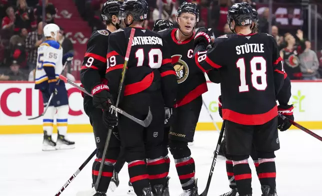 Ottawa Senators left wing Brady Tkachuk (7) celebrates a goal with teammates as they take on the St. Louis Blues during the second period of an NHL hockey game in Ottawa, Ontario, Tuesday, Oct. 29, 2024. (Sean Kilpatrick/The Canadian Press via AP)