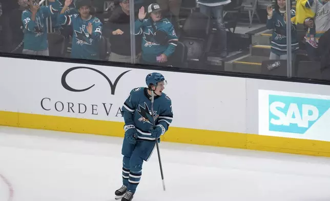 San Jose Sharks center Macklin Celebrini skates on the ice after his goal during the first period of an NHL hockey game against the St. Louis Blues, Thursday, Oct. 10, 2024, in San Jose, Calif. (AP Photo/Godofredo A. Vásquez)