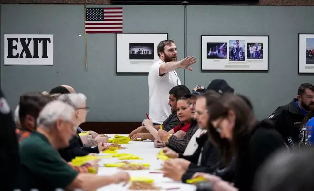 Volunteers tally votes on a new contract offer from Boeing, Wednesday, Oct. 23, 2024, at Seattle Union Hall in Seattle. (AP Photo/Lindsey Wasson)