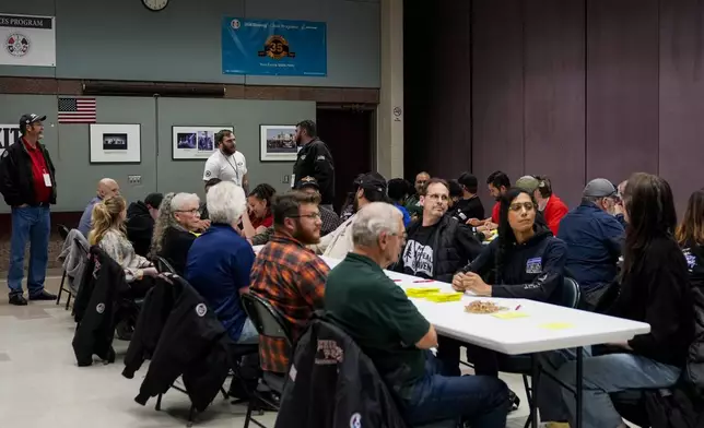 Volunteers tally votes on a new contract offer from Boeing, Wednesday, Oct. 23, 2024, at Seattle Union Hall in Seattle. (AP Photo/Lindsey Wasson)