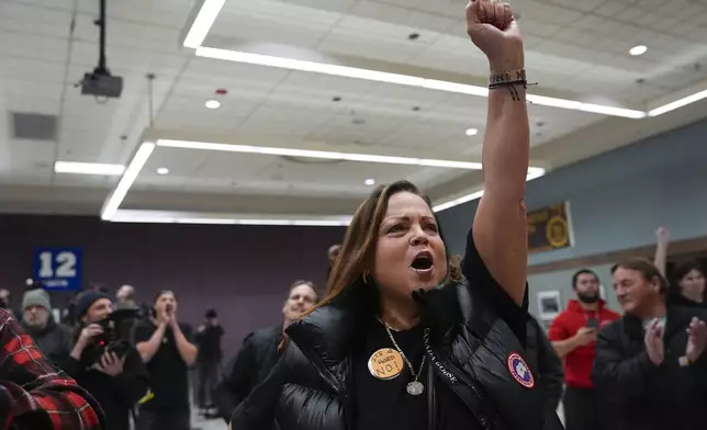 Boeing employee Gina Forbush reacts to the announcement that union members voted to reject a new contract offer from the company, Wednesday, Oct. 23, 2024, at Seattle Union Hall in Seattle. (AP Photo/Lindsey Wasson)