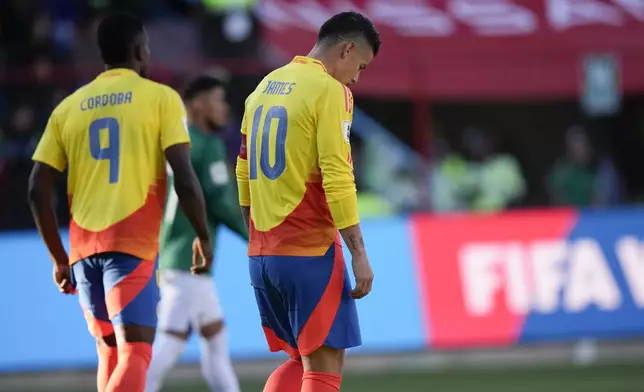 Colombia's James Rodriguez, right, reacts at the end of a qualifying soccer match against Bolivia for the FIFA World Cup 2026 at Municipal de Villa Ingenio stadium in El Alto, Bolivia, Thursday, Oct. 10, 2024. (AP Photo/Juan Karita)