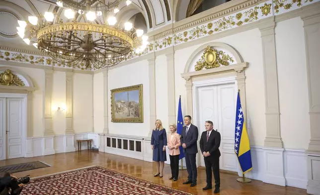 Members of the Bosnian Presidency Zeljka Cvijanovic, left, Denis Becirovic, center and Zeljko Komsic, right, pose for a photo with European Commission President Ursula von der Leyen, prior to the start of their meeting in Sarajevo, Bosnia, Friday, Oct. 25, 2024. (AP Photo/Armin Durgut)