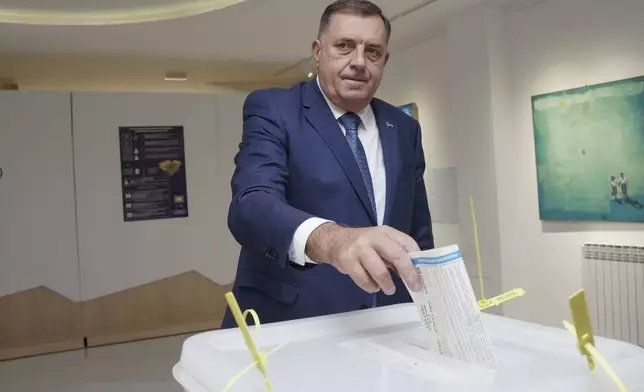 Bosnian Serb leader Milorad Dodik casts his ballot for the local elections at a polling station in Laktasi, northwest of Sarajevo, Bosnia, Sunday, Oct. 6, 2024. (AP Photo/Radivoje Pavicic)