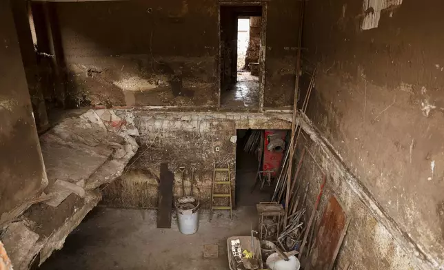 A view inside a house missing a floor following flash floods and landslides in Donja Jablanica, Bosnia, Thursday, Oct. 24, 2024. (AP Photo/Armin Durgut)