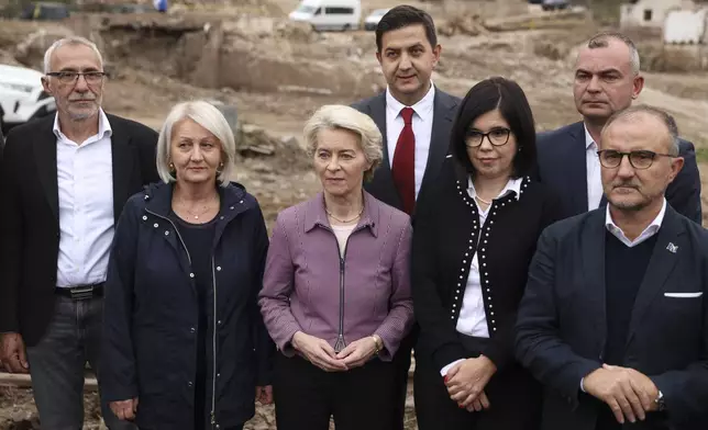 European Commission president Ursula von der Leyen, centre, visits the area which was recently hit by floods and landslides in Jablanica, Bosnia, Thursday, Oct. 24, 2024.(AP Photo/Armin Durgut)