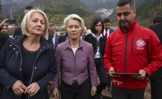 European Commission president Ursula von der Leyen, centre, visits the area which was recently hit by floods and landslides in Jablanica, Bosnia, Thursday, Oct. 24, 2024. (AP Photo/Armin Durgut)