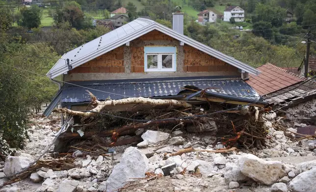 A damaged house is seen after floods and landslides in the village of Donja Jablanica, Bosnia, Saturday, Oct. 5, 2024. (AP Photo/Armin Durgut)