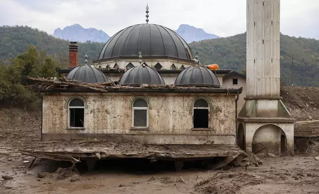 A mosque is seen submerged in mud following flash floods and landslides in Donja Jablanica, Bosnia, Thursday, Oct. 24, 2024. (AP Photo/Armin Durgut)