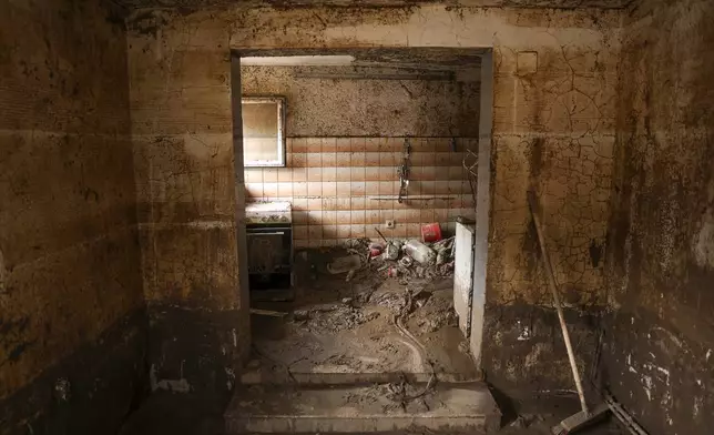 A view inside a house covered with mud following flash floods and landslides in Donja Jablanica, Bosnia, Thursday, Oct. 24, 2024. (AP Photo/Armin Durgut)